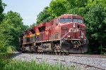 A northbound grain train rolls around the bend at Lassiter Road 